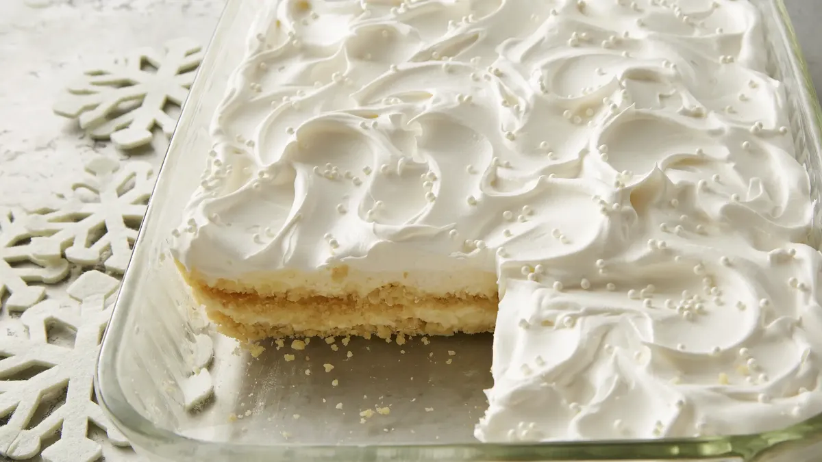 Layered bars with cookies, white chocolate, and pudding.