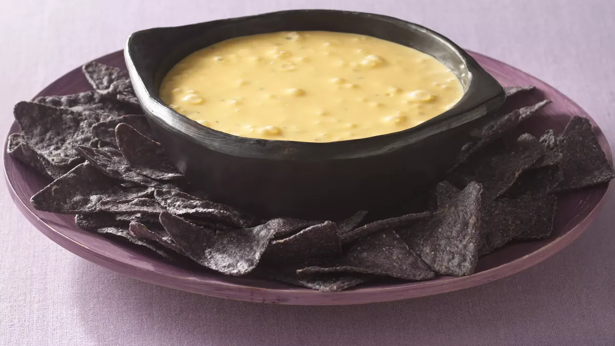 Bubbling Cauldron Cheese Dip with Bat Wing Dippers