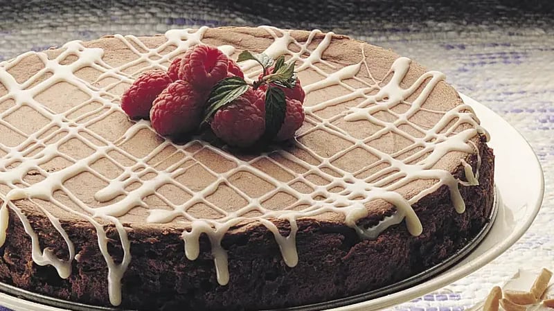 Bittersweet Chocolate Cheesecake with White Truffle Sauce