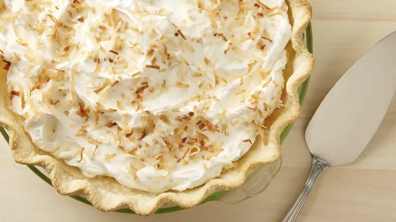 Coconut cream pie and serving knife.