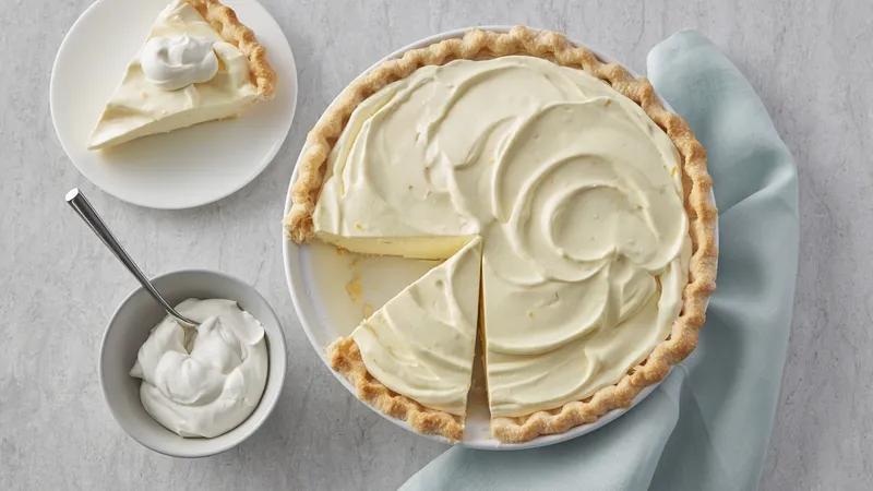 Sliced and whole luscious lemon cream pie.