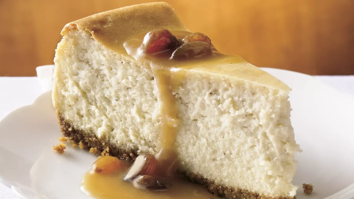 Hot Buttered Rum Cheesecake with Brown Sugar-Rum Sauce