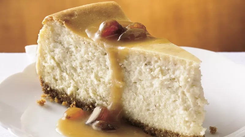 Hot Buttered Rum Cheesecake with Brown Sugar-Rum Sauce