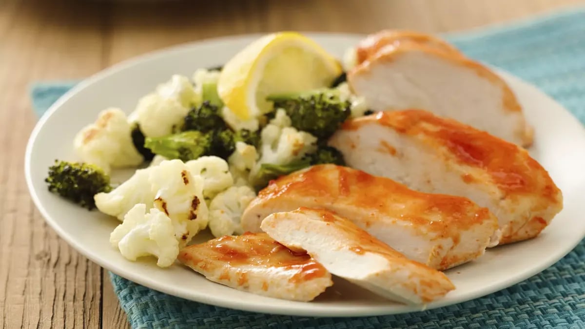 Healthy Sriracha Chicken with Roasted Broccoli and Cauliflower