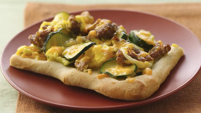 Breakfast Pizza with Eggs, Sausage, and Vegetables