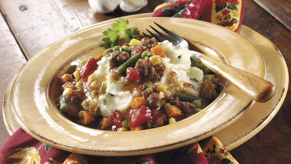 Ground Beef Stew over Garlic Mashed Potatoes