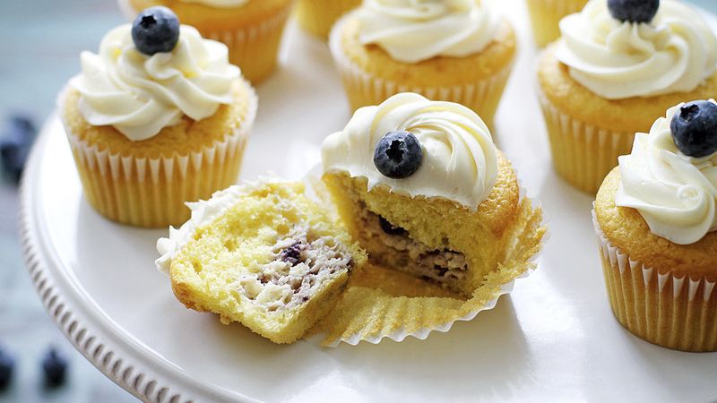 Blueberry Cheesecake-Stuffed Lemon Cupcakes with Vanilla Frosting
