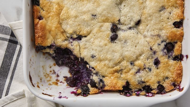 A close-up photo of a blueberry cobbler in a baking dish. The cobbler has a golden brown, crumbly crust and is filled with plump, purple blueberries. Some blueberries are bubbling over the edge of the crust. (Photo Courtesy Sandra Lee/TM General Mills)A close-up photo of a blueberry cobbler in a baking dish. The cobbler has a golden brown, crumbly crust and is filled with plump, purple blueberries. Some blueberries are bubbling over the edge of the crust. (Photo Courtesy Sandra Lee/TM General Mills)