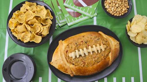 Taco Dip in a Football Bread Bowl