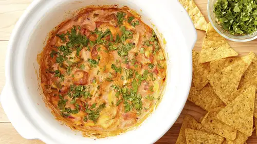 Slow cooker chicken queso dip with green chiles and cilantro