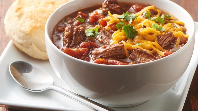 Slow-Cooker Texas Chili prepared recipe in a bowl topped with cheese