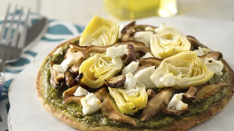 Pita Pizza with Arugula Pesto, Artichokes, Shitake Mushrooms and Goat Cheese